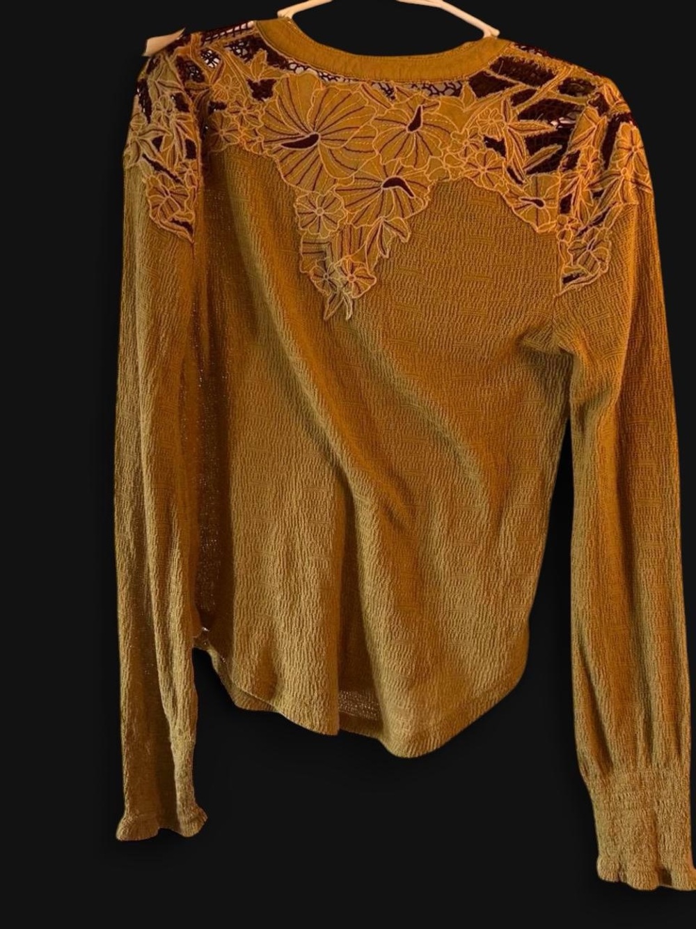 Free People embroidered henley long sleeve thermal top in an earthy green tone